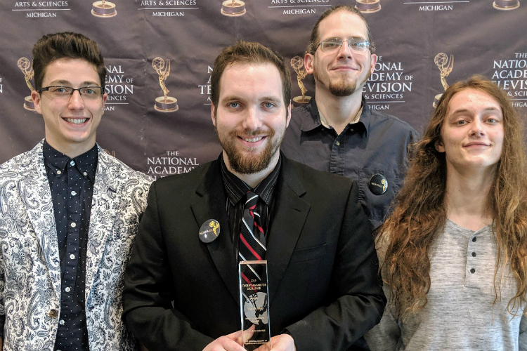 Cliff Groat of Waterford (center) with three of his fellow "Trial by Fire" crew members (L-R) Julian York of Flushing, Mike Tomchuck of Flint, and Levi Bamford of Columbiaville.