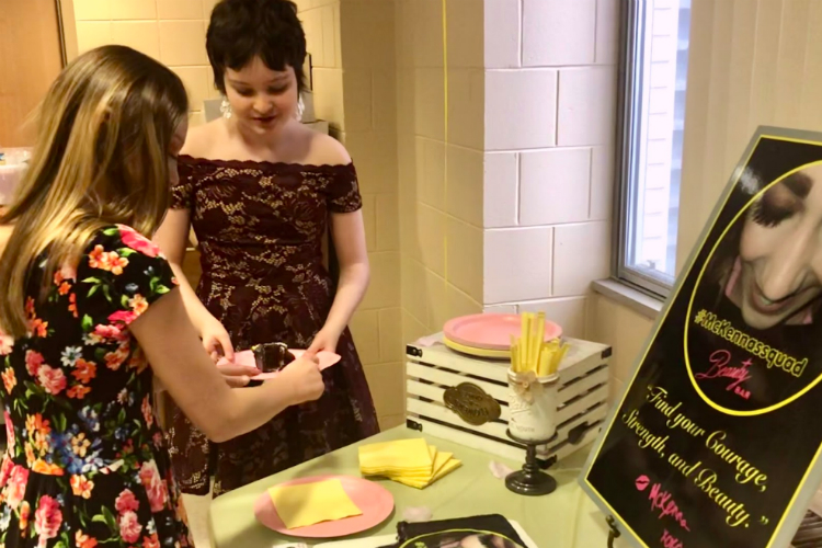 Lauren Stansburry, a friend and classmate of McKenna's, receives the first Beauty Bar Box at Hurley Hospital.