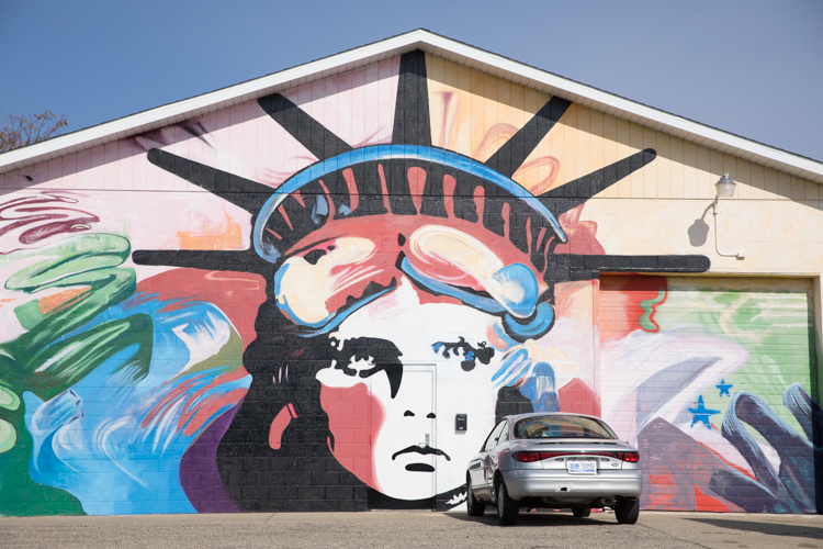 Lady Liberty stands proud at Grand Traverse and Oakley streets.