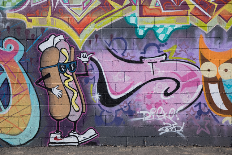 A mural at a coney place wouldn't be complete without a hotdog. 
