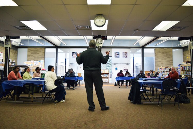 Flint schools superintendent Derrick Lopez engages Brownell-Holmes residents Thursday March 5, 2020 