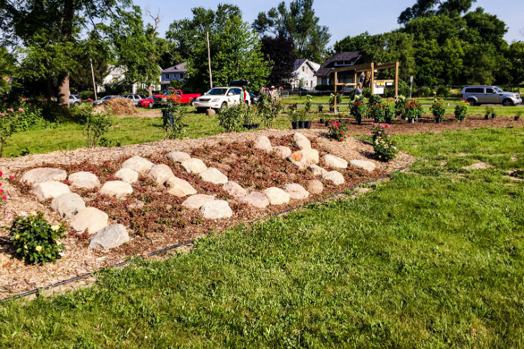 The Peace Garden features a raised mound with rocks arranged to spell "MLK"— large stone  also features a large mound stones arranged to spell out “MLK”—"so passers-by know what this stands for," says organizer Barbara Culp.