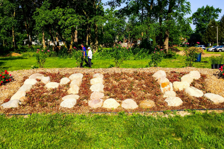 The Peace Garden features a raised mound with rocks arranged to spell "MLK"— large stone  also features a large mound stones arranged to spell out “MLK”—"so passers-by know what this stands for," says organizer Barbara Culp.