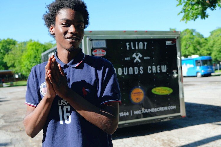 Montrae King, 17 eyeing the camera before heading off to work at the Agriculture House on Rankin Avenue.