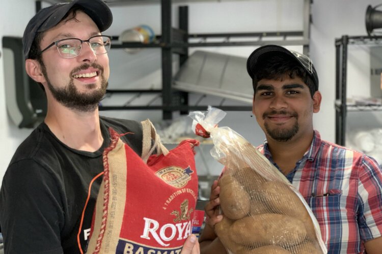 Jon Hardman (left) and Nikhil Mukkamala combined talents and tradition to start a new Flint food truck, Naan Stop