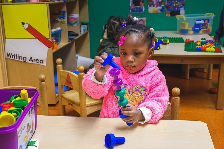 Child at NEST Child Care and Parent Institute in Detroit.