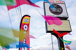 Niko’s Family Diner sign is decorated with “Now Open” banners to welcome new customers on November 22, 2023. 