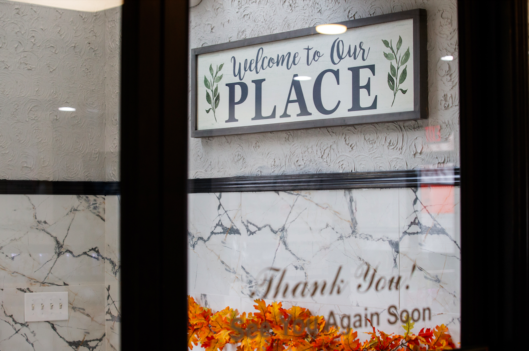 Greeting signs hang at the entrance of Niko’s Family Diner on November 22, 2023.