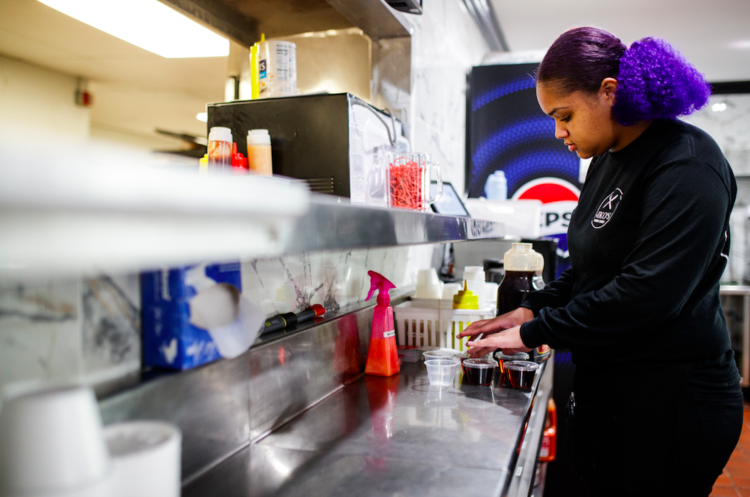 Destiny Wicks prepares maple syrup for distribution to customers at Niko’s Family Diner on November 22, 2023.