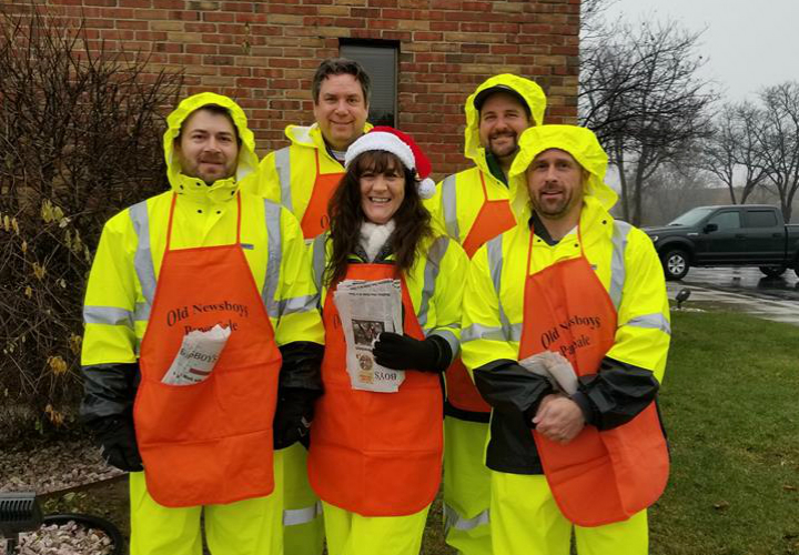 Volunteers raise money through the annual Old Newsboys of Flint newspaper sale on Dec. 18, 2018.