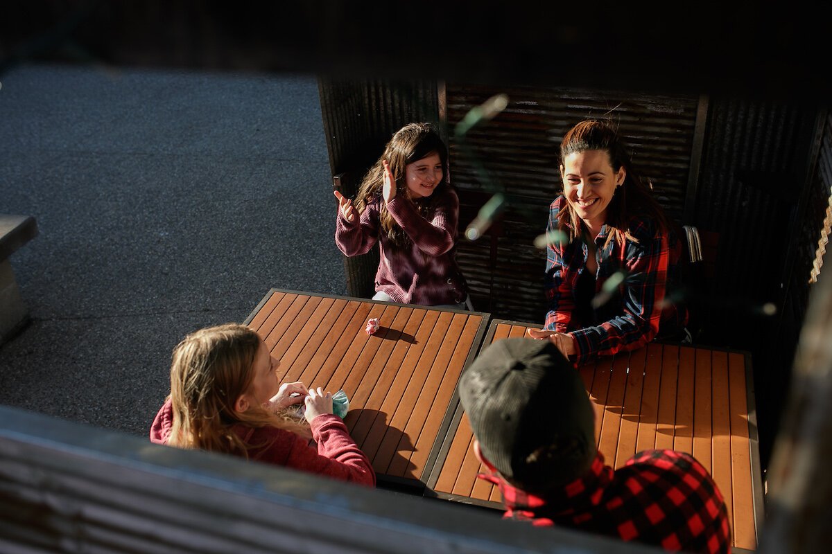 The Parks family plays a game outside.