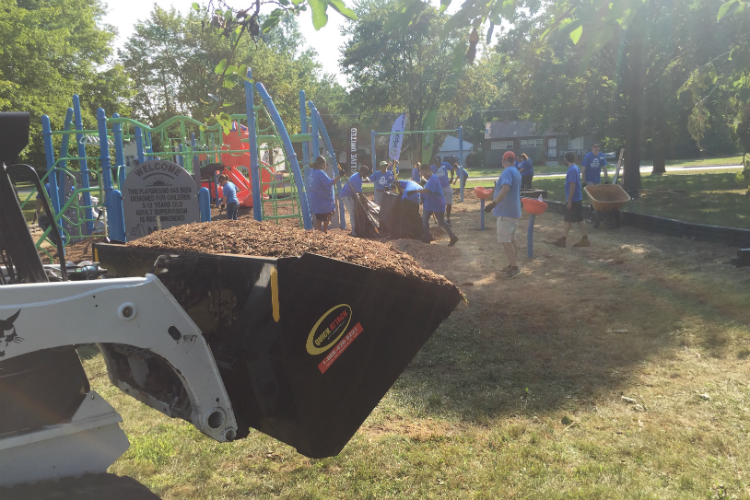 A small bull dozer also helps to get the new playground area mulched at Hasselbring Senior Center.