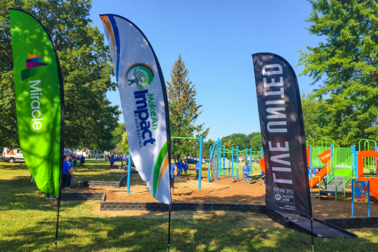 Volunteers helped a new playground open Tuesday at Hasselbring Senior Center. About 80 percent of the $150,000 funding comes from the Flint Child Health and Development Fund (often called FlintKids.org) and the Community Foundation of Greater Flint.