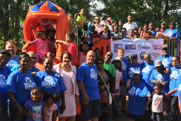 Volunteers helped a new playground open Tuesday at Hasselbring Senior Center. About 80 percent of the $150,000 funding comes from the Flint Child Health and Development Fund (often called FlintKids.org) and the Community Foundation of Greater Flint.