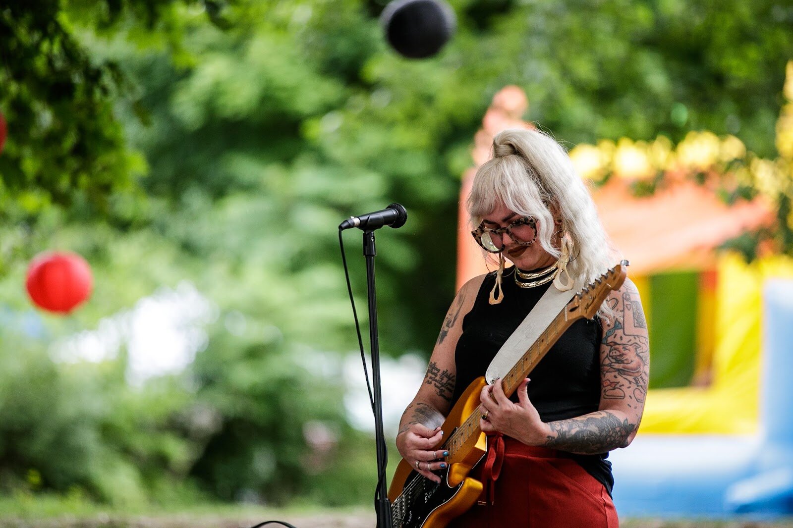 Polly, local musician, plays music during Porch Fest on Friday, July 15, 2022.