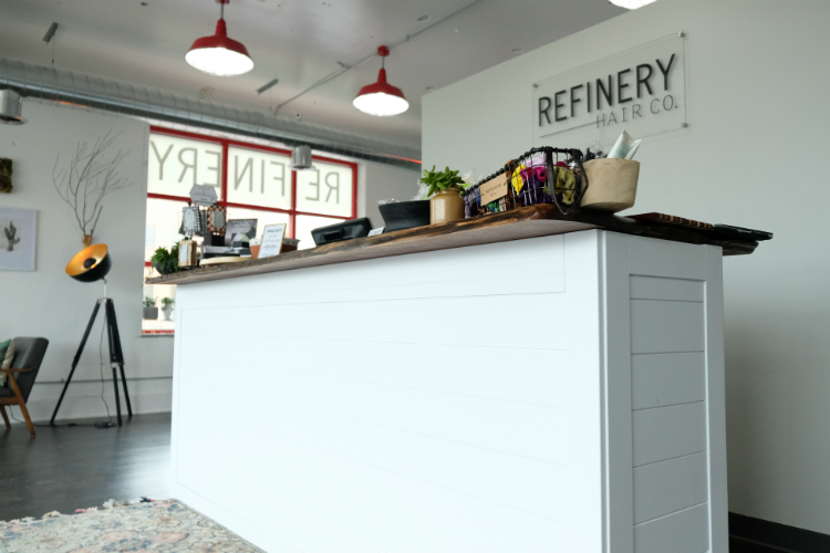 Refinery Hair Co. features modern line with earthy wood elements to highlight the relaxing atmosphere inside.