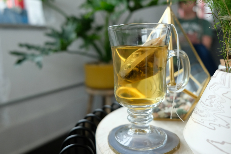 Refinery Hair Co. offers patrons a glass of custom blend tea. 