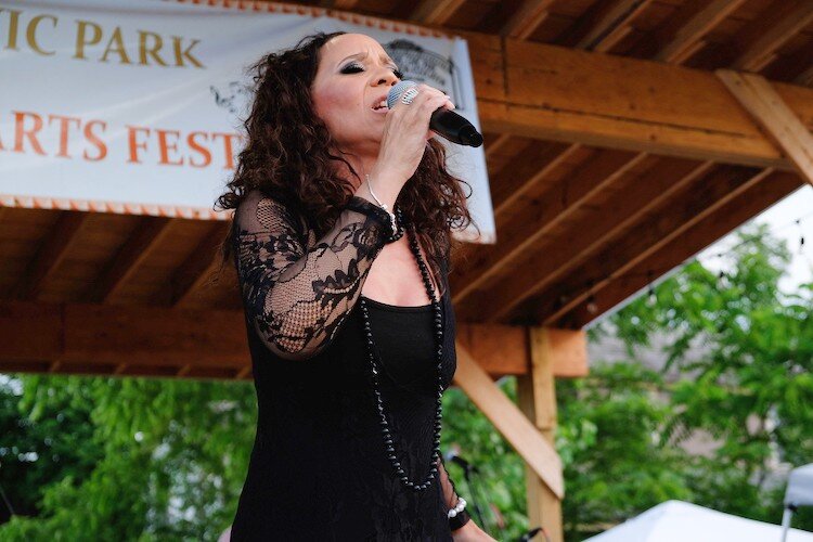 Rhonda Clark, a Flint native who has produced three records,  belts out an Aretha Franklin tribute on her hometown stage during the Heritage and Harmony festival.