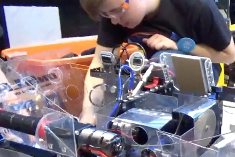 Ian Wickham, 15, works on Big Mo team 314's robot. 