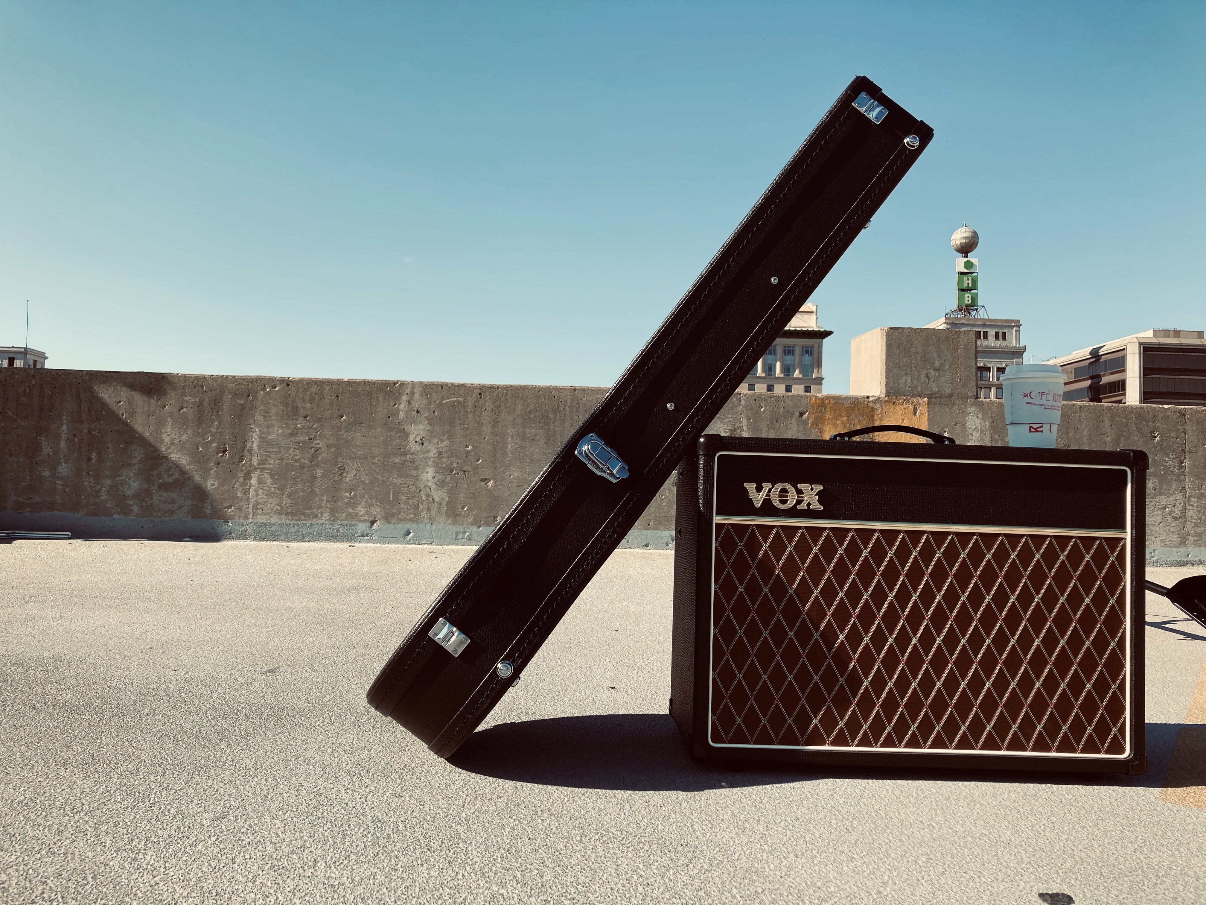 Lucas Perro's guitar case and amp, with Flint's Weather Ball in the background.