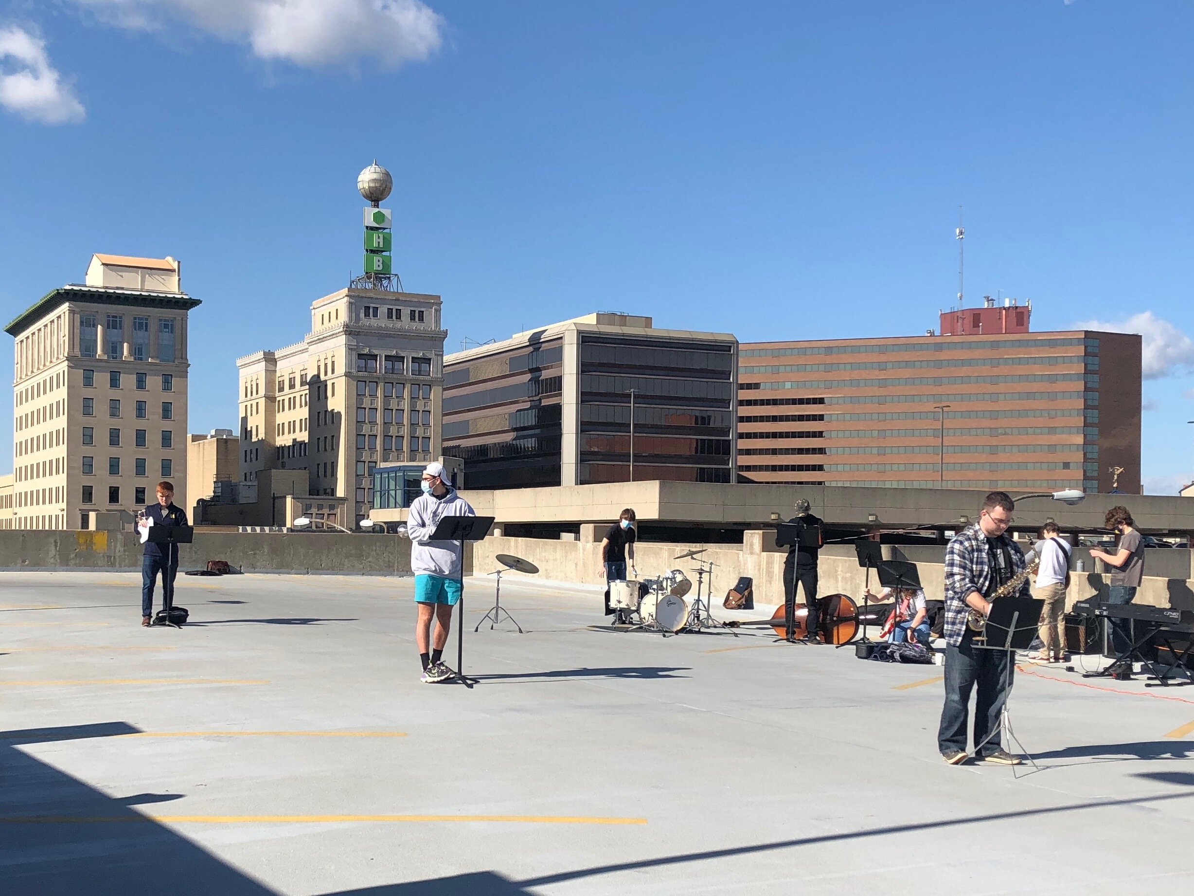 The UM-Flint Jazz Ensemble setting up for an October performance on the roof of a parking garage.