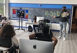 RushDee did a Q and A session with students as part of a visit to Flint's Sylvester Broome Empowerment Village on July 8-9.