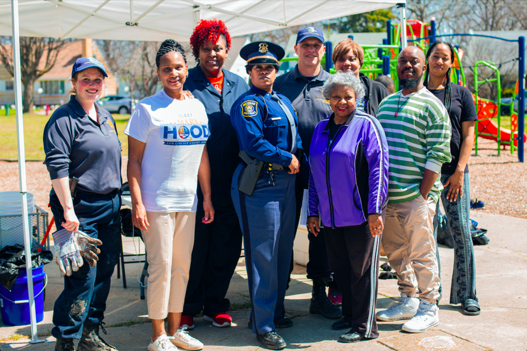 Community leaders, residents, law enforcement, and the Flintside team pose together in Sarvis Park for their Cleanup Day and to kick off On the Ground.