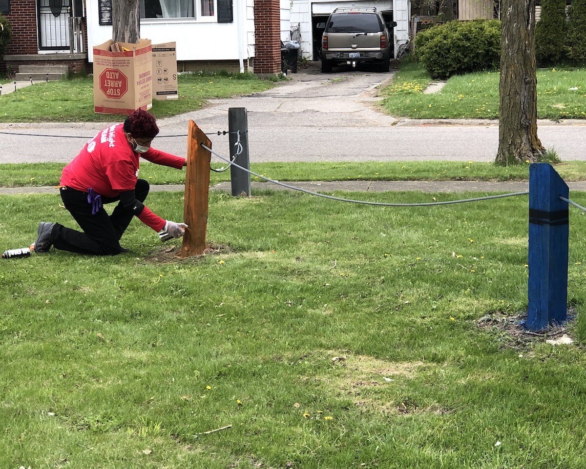 Flint Public Art Project partnered with volunteers in Sarvis Park to turn fence posts into crayons on April 24.