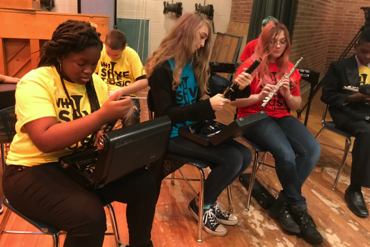 Students at Scott Middle School check out the new instruments provided through VH1 Save the Music Foundation. 