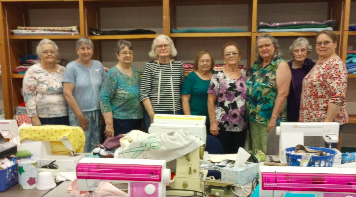 Let’s Sew for Kids' Monday group: (r) Deianna Bower, Joann Wahl, Suzette Fraley, Jane Lee, Lois Adamson, Marcia Kramer, Elaine Wischmeyer, Marie Bechtel, and Nina Markee.