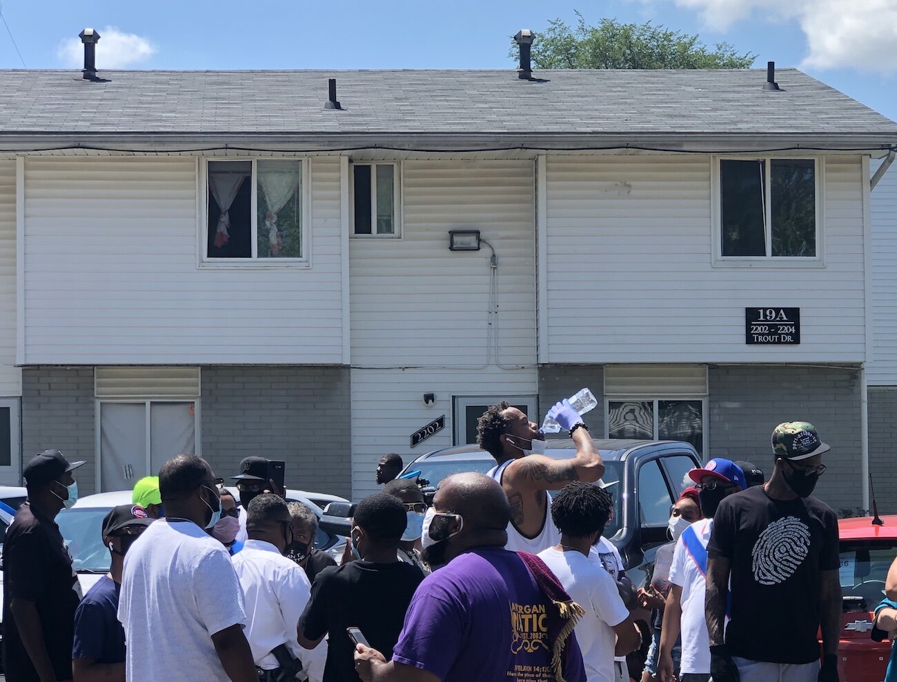 Rasheed Wallace takes a water break while distributing food and water to residents at Evergreen Regency Estates.