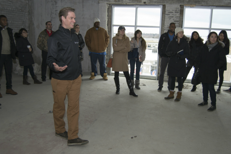 University of Michigan students tour the Ferris Wheel Innovation Hub in downtown Flint as part of their research in the Social Impact Challenge 