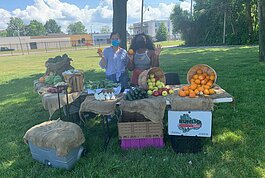 A farm stand at Butzel Family Recreation Center in Detroit, sponsored by Henry Ford Health, Come Play Detroit, and Eastern Market.