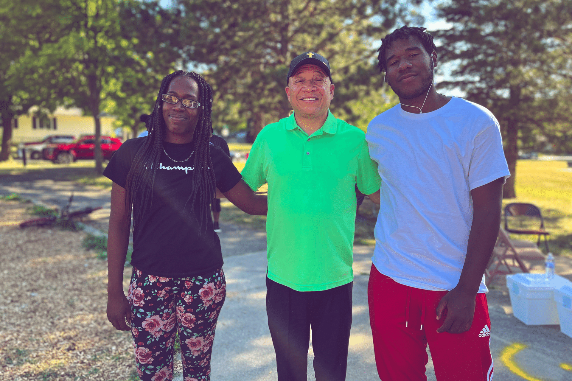 Hamady High School graduate Kealen Gilbert poses with his mother and Flint Mayor Sheldon Neely at Sarvis Park's Open House