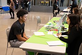 A student interviews for a summer job during the 2022 Summer Youth Initiative (SYI) job fair.