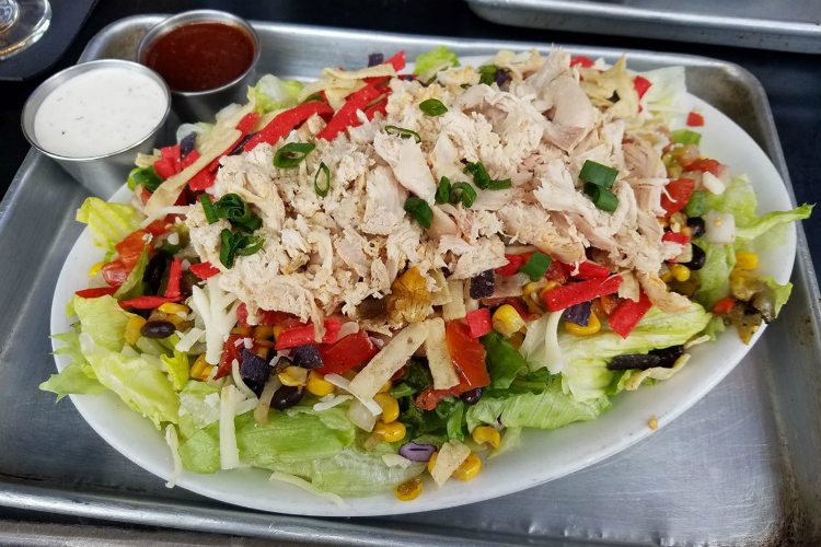 The new menu at Table and Tap includes the BBQ Smoked Chicken Chopped Salad. Even more additions are expected after Table and Tap Express opens.