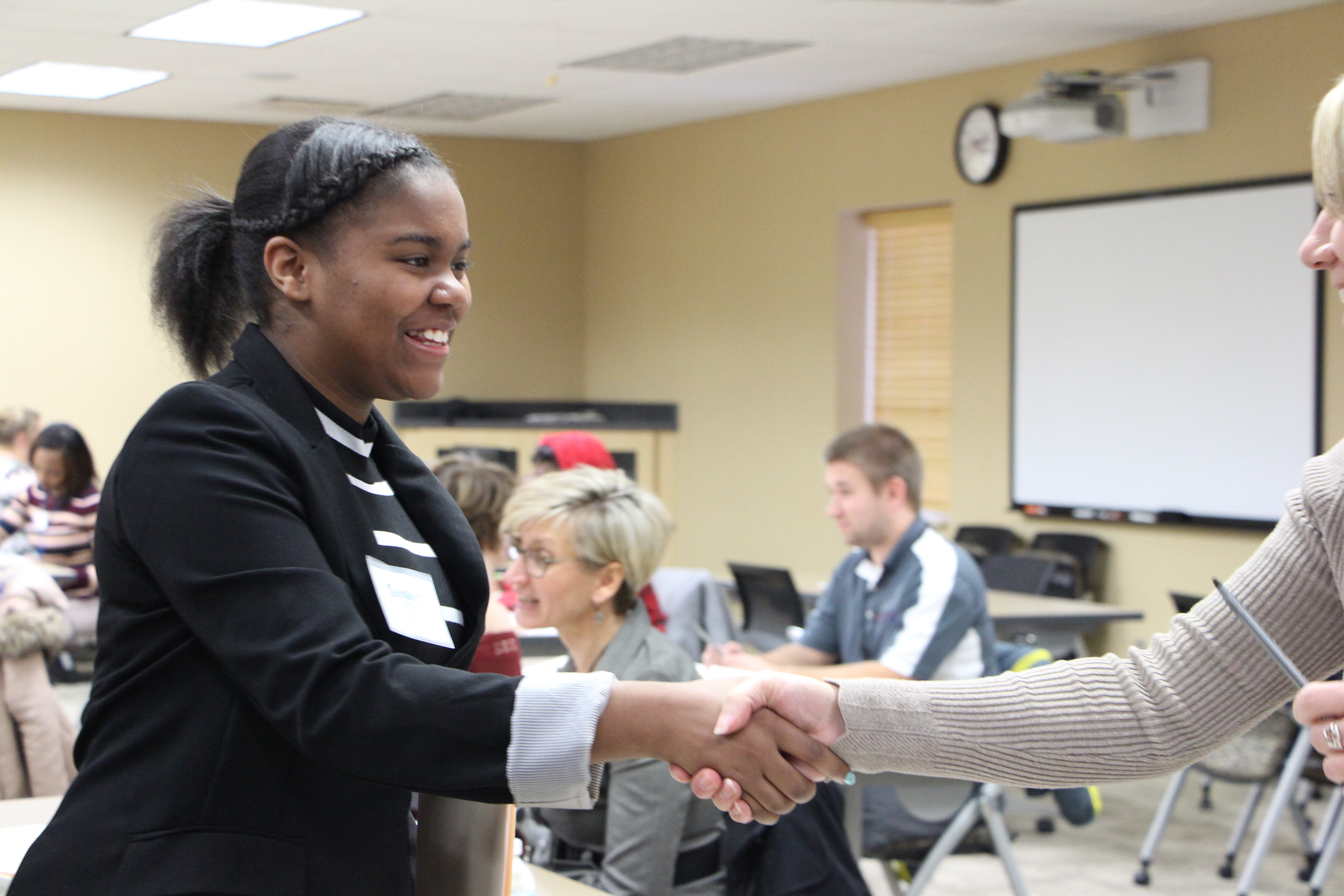 A student participates in a mock interview during TeenQuest's job preparedness program.