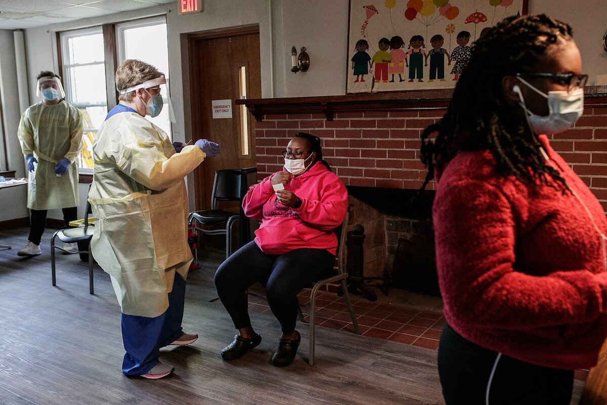 A Shelter of Flint employee gets tested by Sally Dennie, a nurse working for Honu Lab.