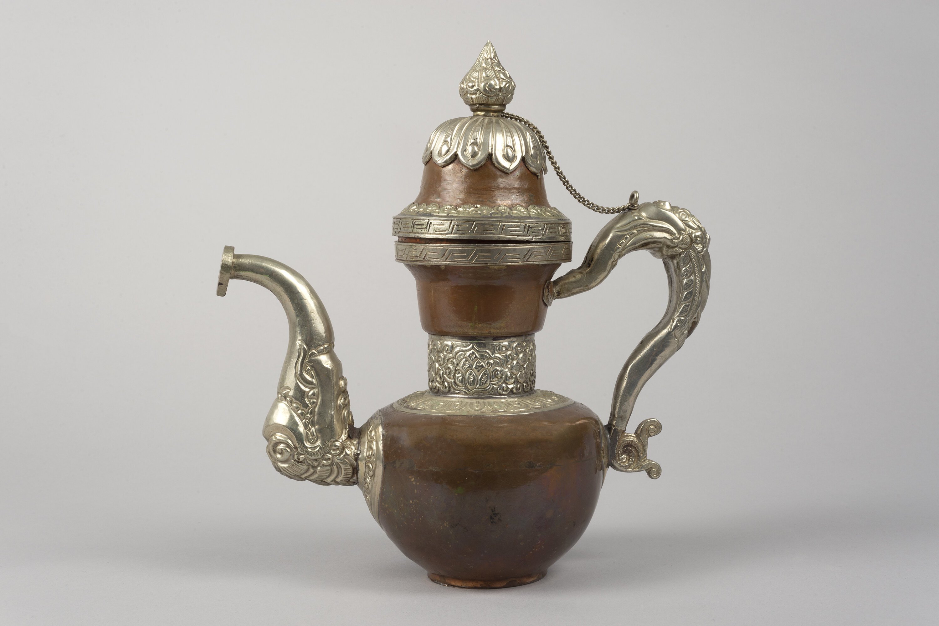 Tibetan Teapot. 19th century. Brass with silver overlay, 8 5/16 × 8 7/8 in. (21.1 × 22.5 cm). Gift of F. Karel Wiest. 1982.240.