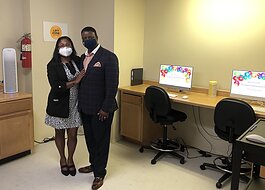 Sonyita and Dwayne Clemons of Total Life Prosperity inside the Empowerment Zone at River Park Apartments.
