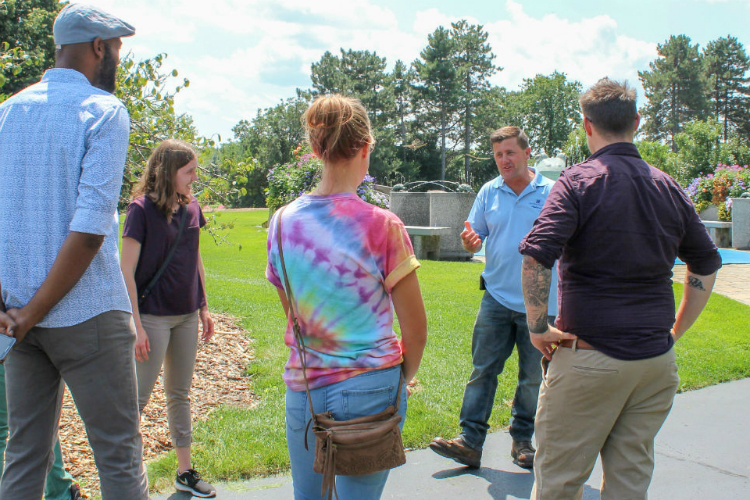 Todd Bakos (second from right) was named in December to oversee the grounds of Applewood estate.