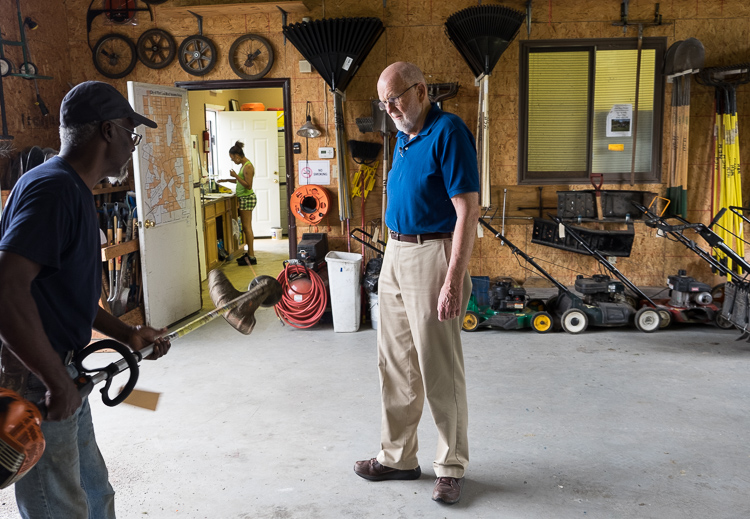 Hurb Pitts (left) talks about the condition of equipment with NEH board member Jim Richardson.