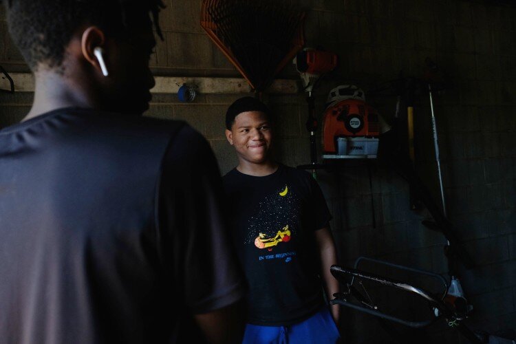 Travon Marshall, 15 stands waiting in the toolshed at Joy Tabernacle.