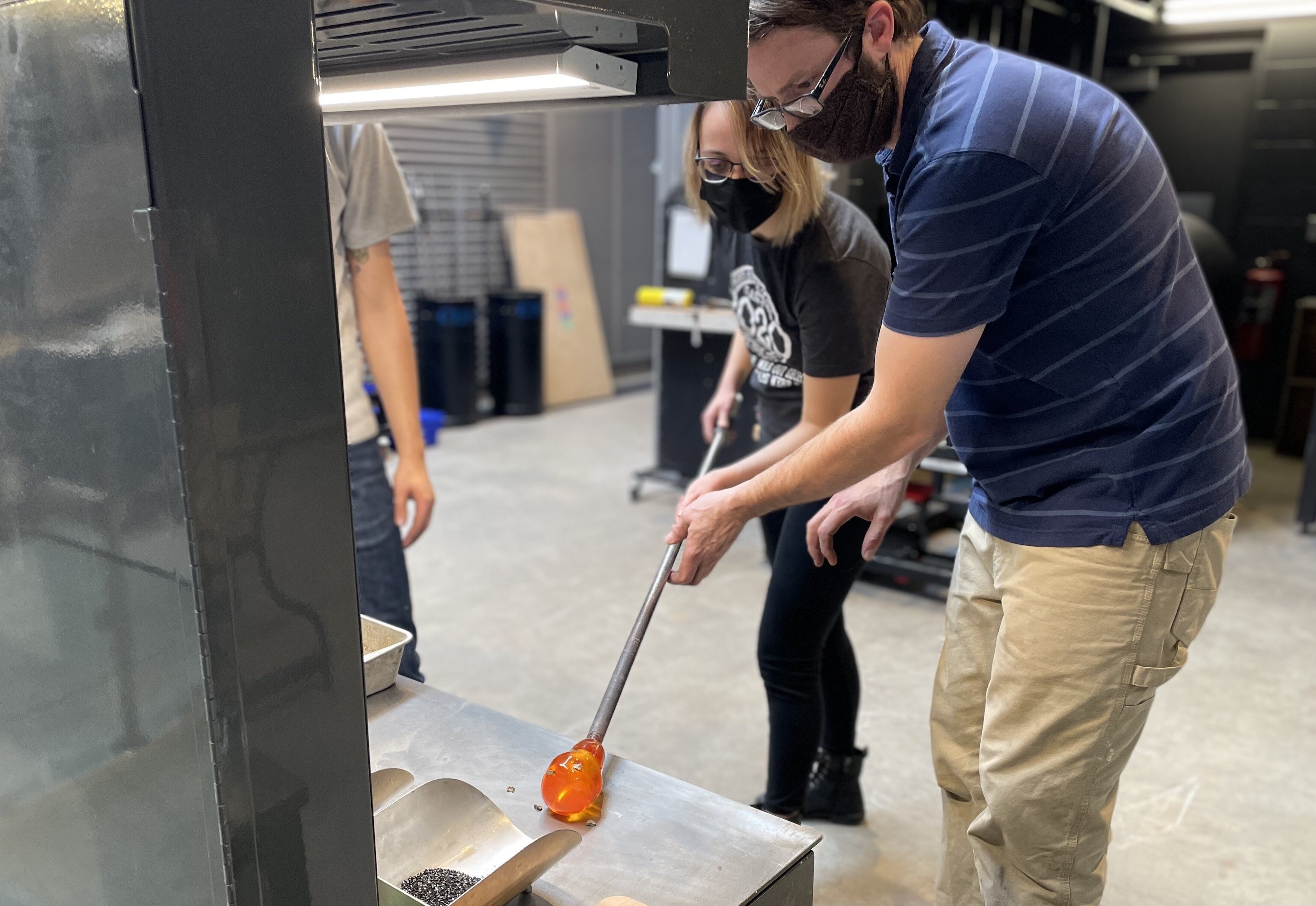 “The instructors are great, they walk you through everything to make sure you do it safely.” - Josie Anderson, UM-Flint student, pictured here working with FIA glass programs manager Brent Swanson.