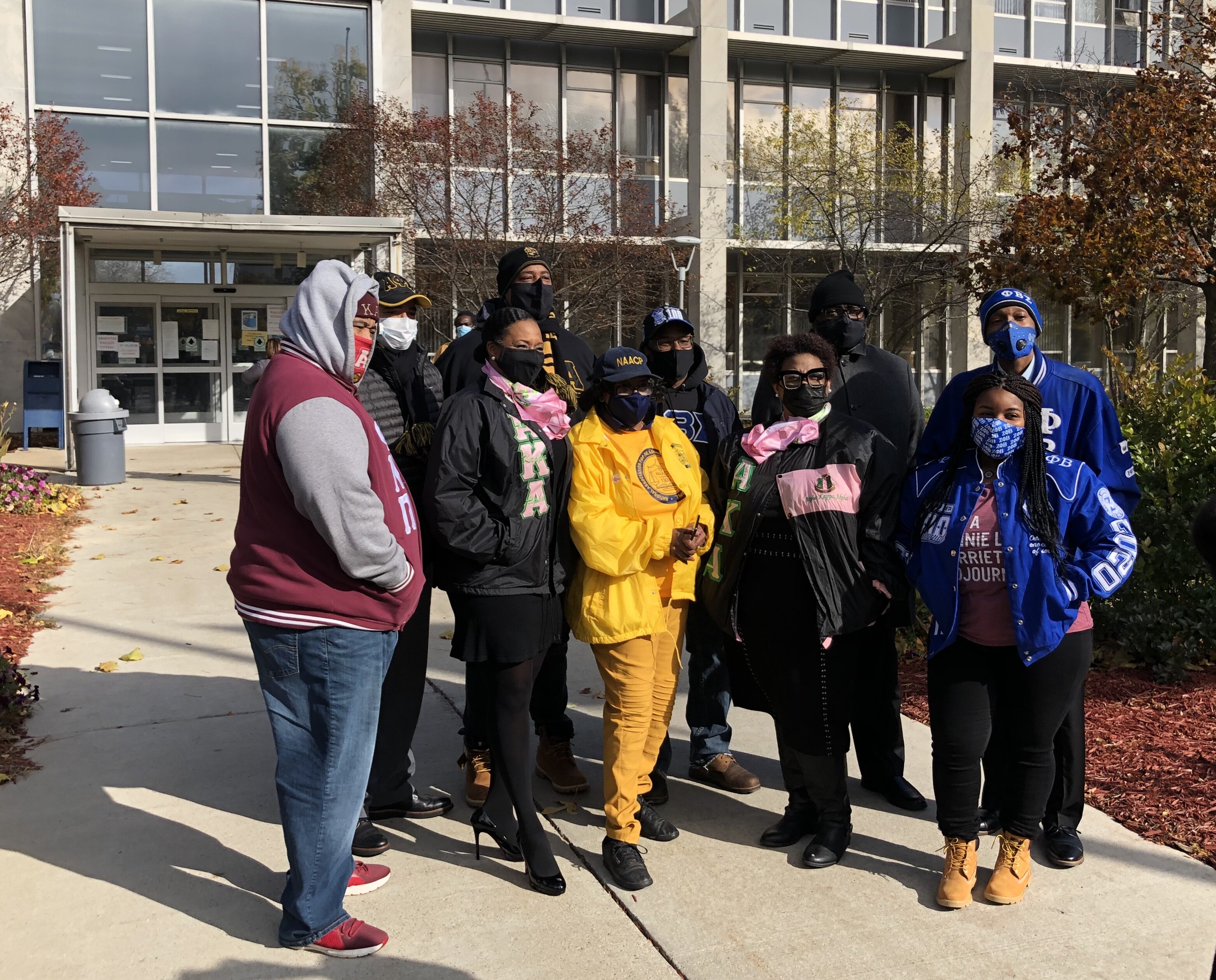 Organizers of a #walkthevote parade in Flint in front of City Hall on November 1.
