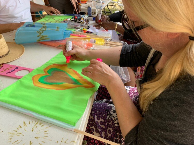 As part of the theme for the art parade, marchers were encouraged to decorate their flags according to their own individual identity.