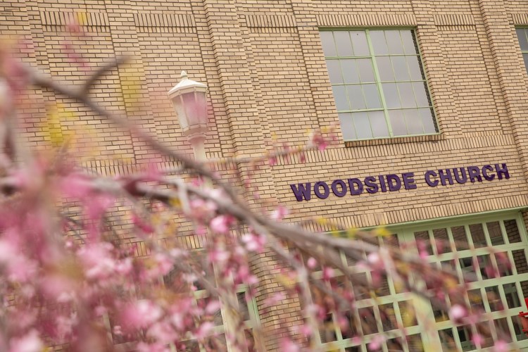 The sign is on the building and Woodside Church expects to open in new location in June 2019.